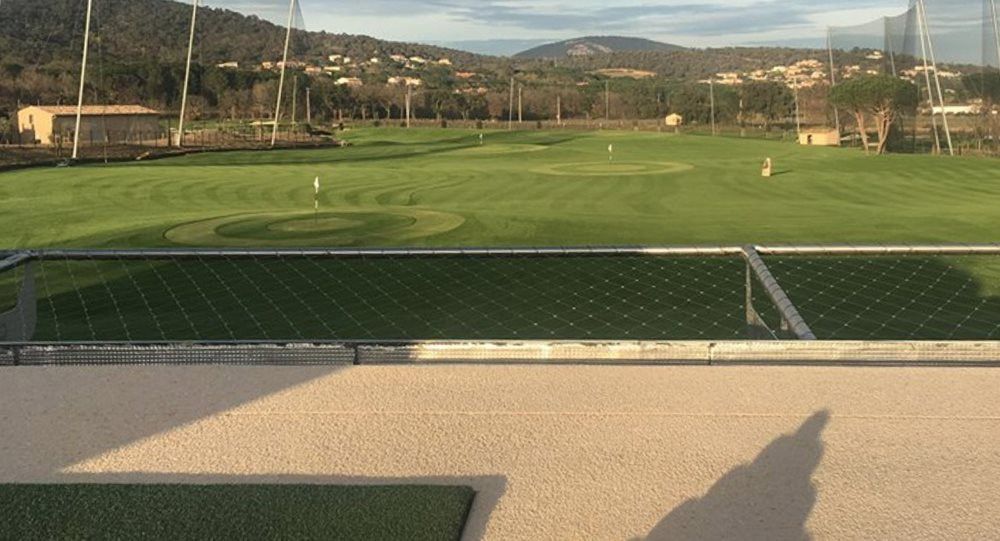 Naperville Synthetic turf beside natural grass golf course