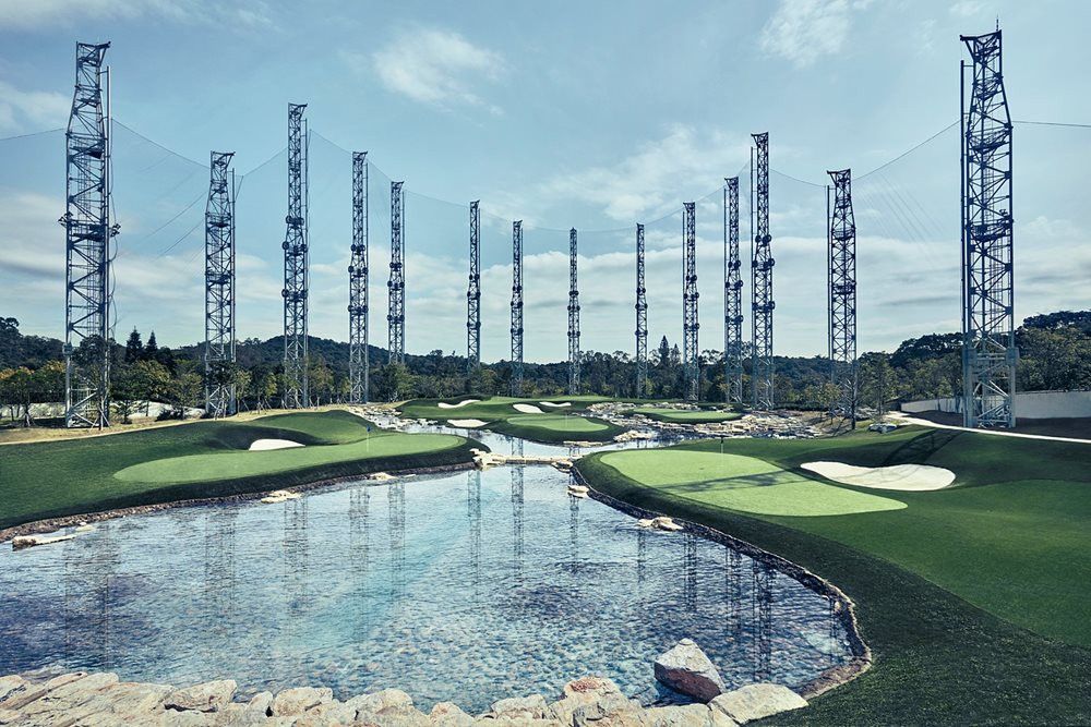 Naperville Synthetic grass golf course with water and tall metal towers