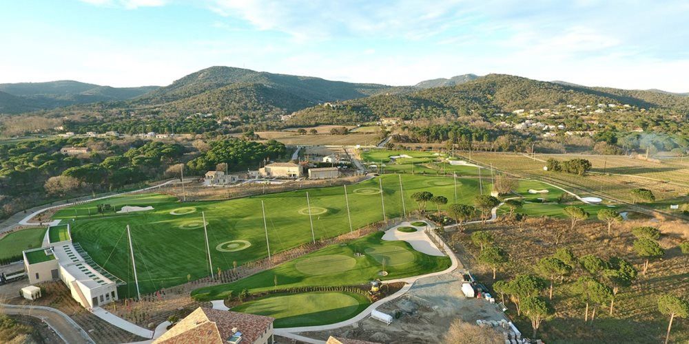 Naperville Aerial view of a synthetic grass golf course surrounded by hills