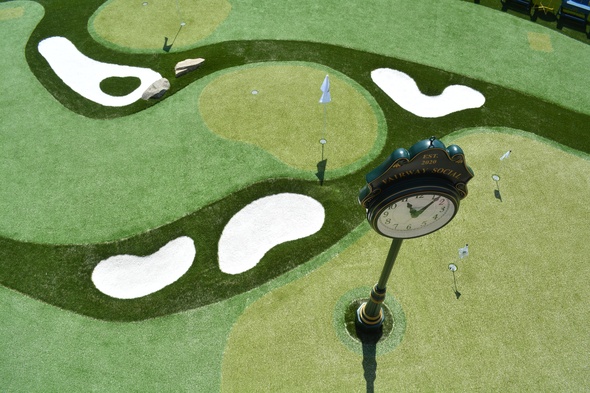 Naperville Synthetic grass golf course with sand traps and golfers